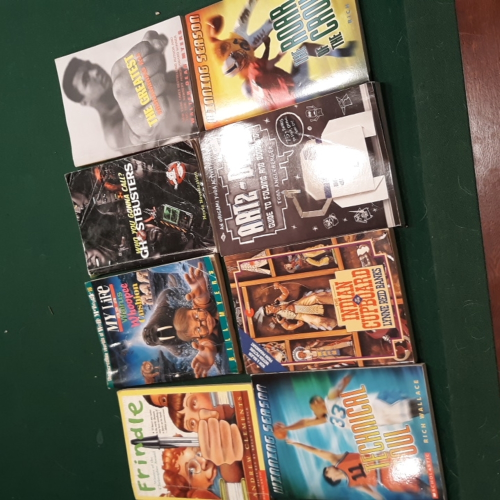 8 Young Boys reading books